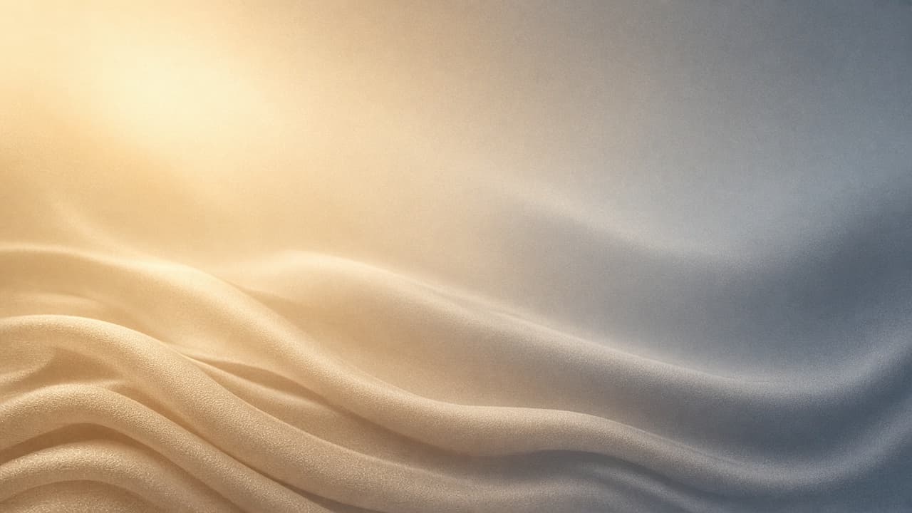 Abstract warm-to-cool gradient, cream and gold on the left fading into cool gray-blue on the right. No people.